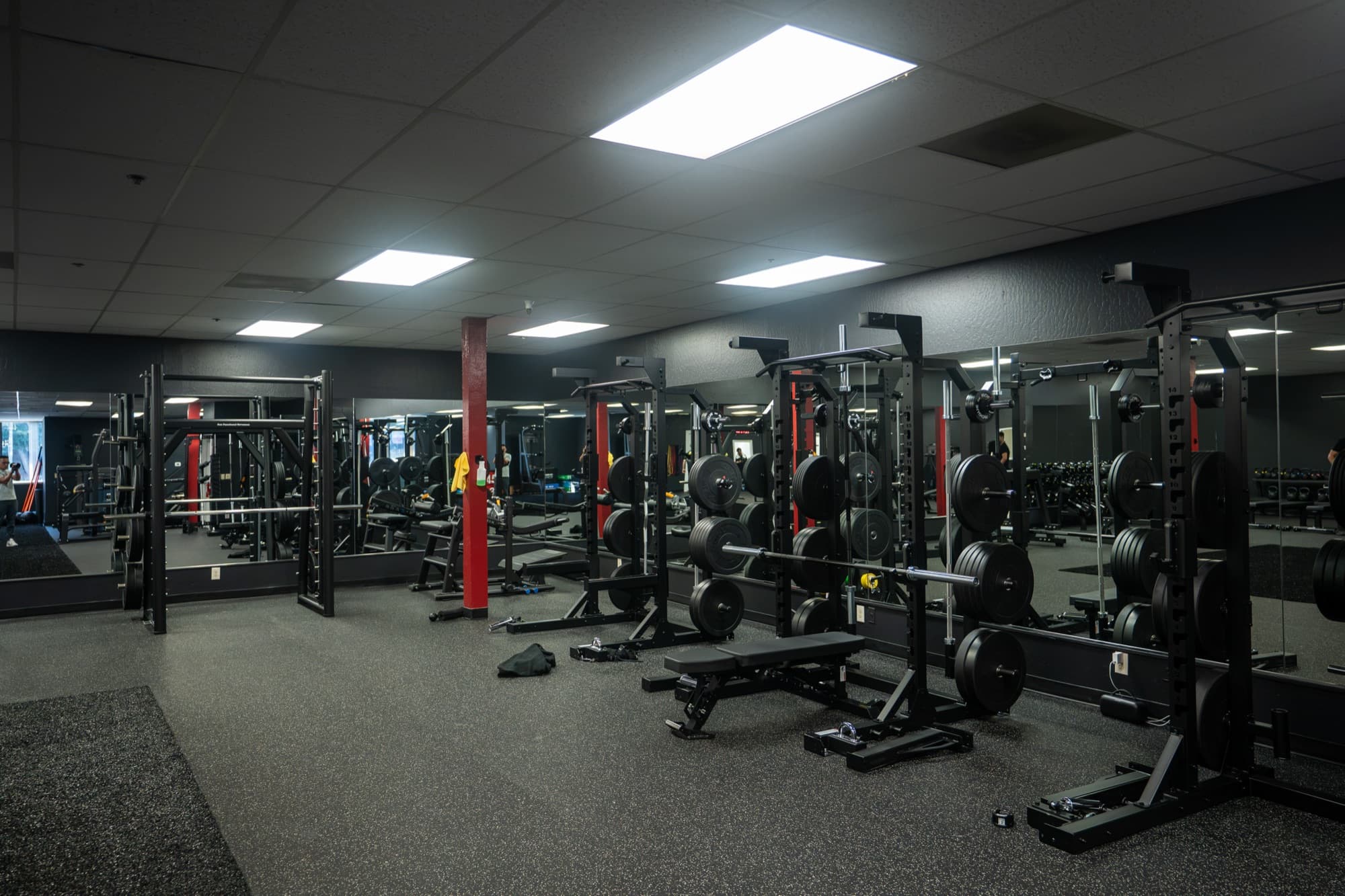 Training floor at Sun Functional Movement in San Jose with squat racks and cable machines